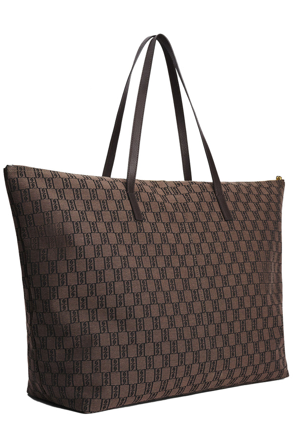 Rotated By Malene Birger brown handbag with By Malene logo pattern in darker brown, shown against a plain white background.