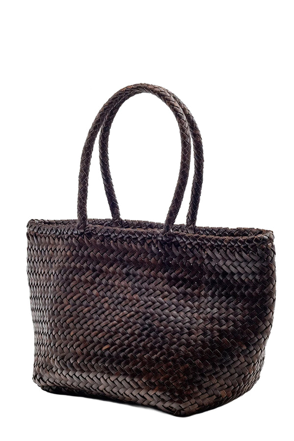 Rotated view of Dragon Diffusion oval woven leather tote bag in dark brown, shown against a plain white background.