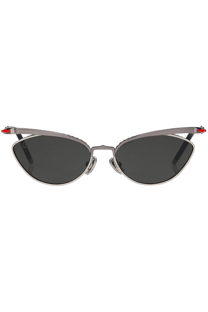 Christian Louboutin sunglasses in gray with metal frame and red details, shown against a plaid white background.