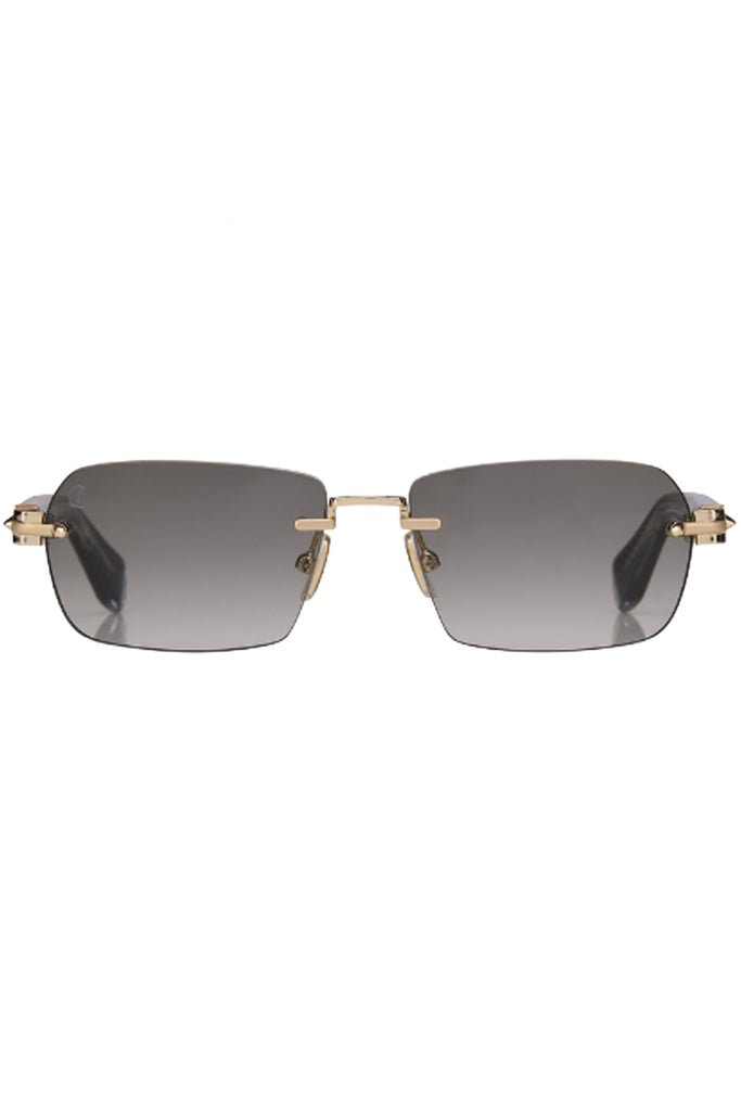 Christian Louboutin sunglasses in gray with metal frame in gold, shown against a plaid white background.