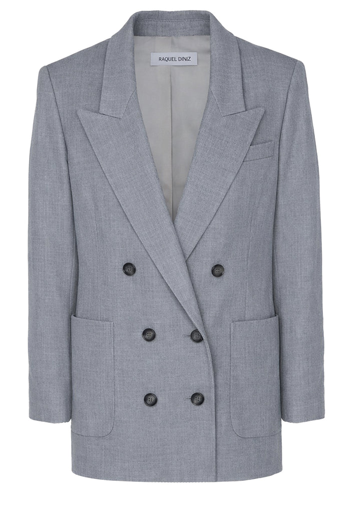 Raquel Diniz double-breasted blazer in light gray with black buttons, shown against a plaid white background.