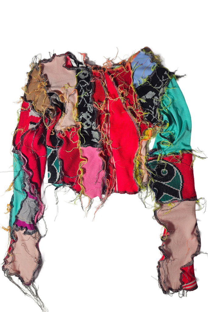 Borbala long sleeve top sewn together from reused red, green, black and pink materials, shown against a plain white background.