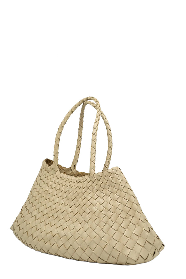 Rotated view of Dragon Diffusion woven leather tote bag in soft white, shown against a plain white background.