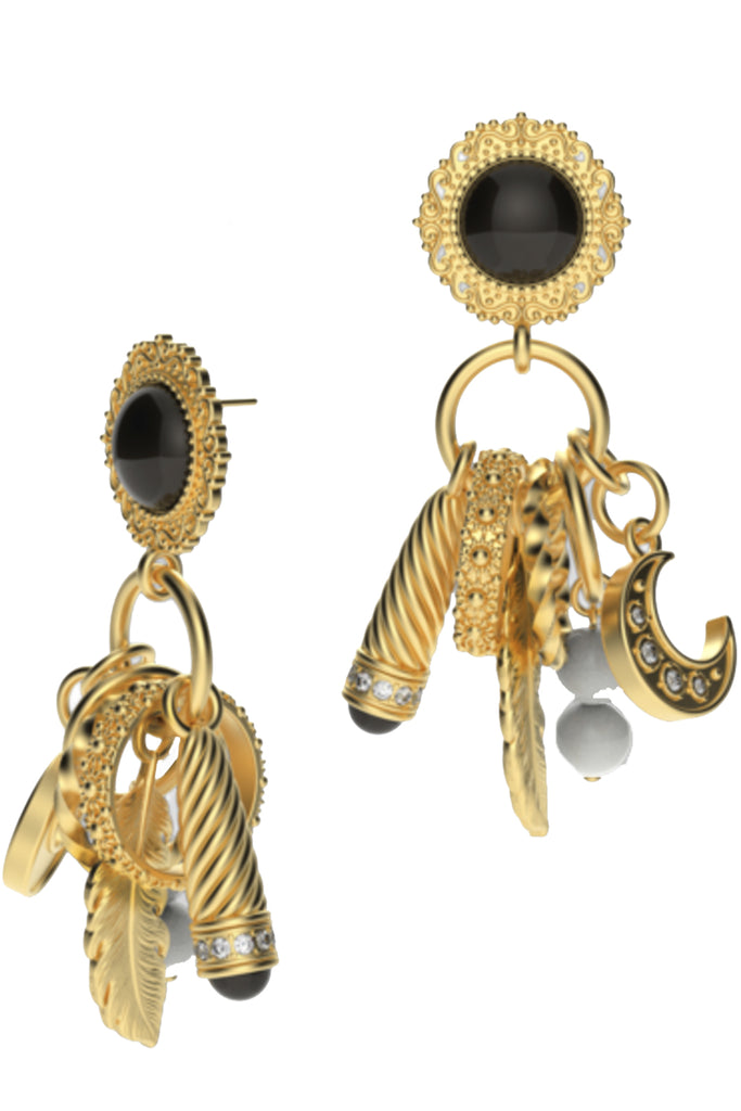 Raquel Diniz earrings in gold,pearl and black with detailed elements, shown against a plaid white background.