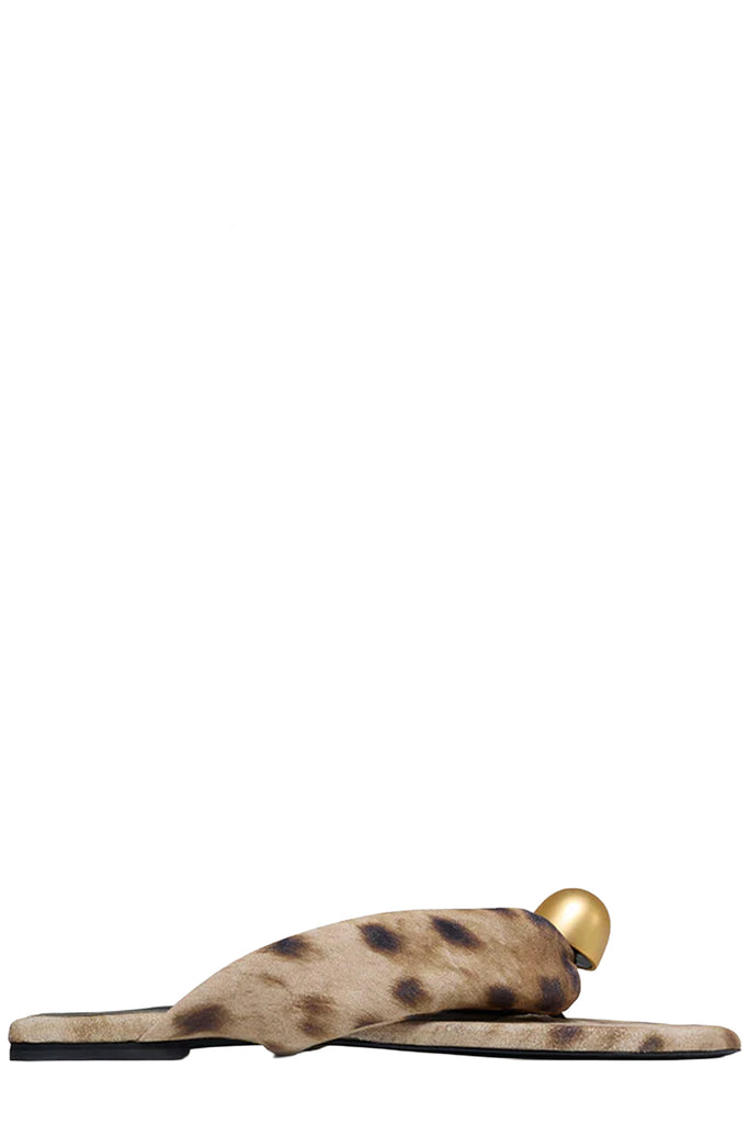 Vanda Novak flat sandal in brown and beige made from leather with golden detail, shown against plaid white background. 
