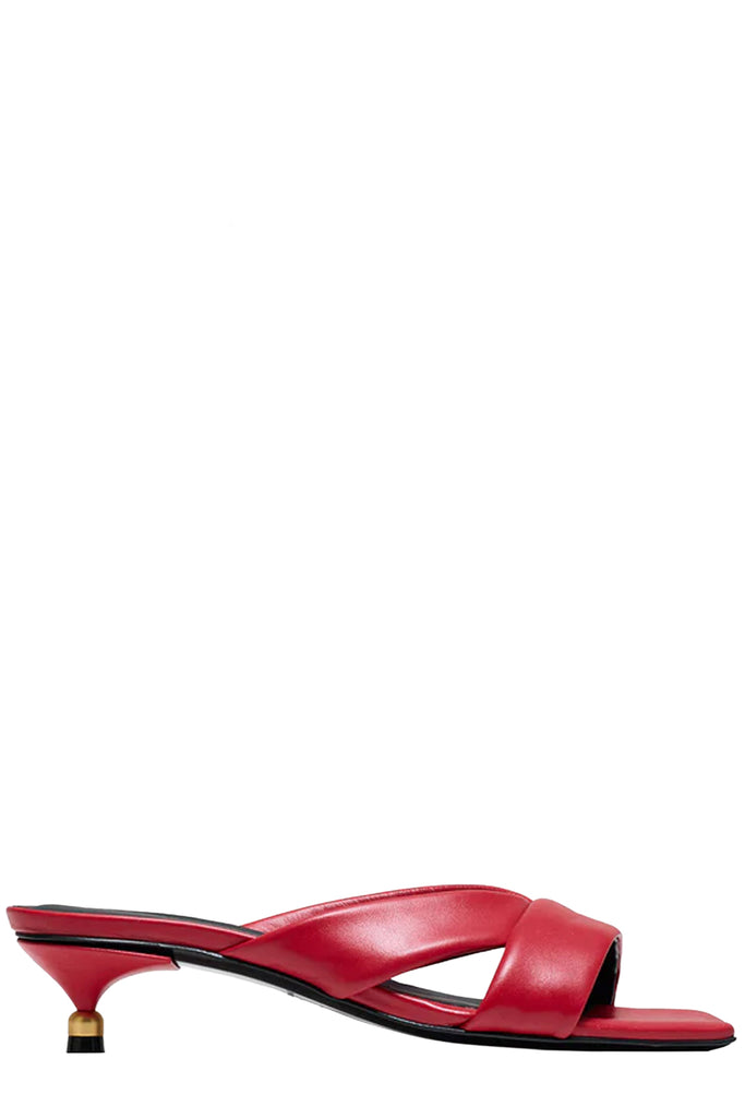 Vanda Novak heeled sandal in red made from leather with golden details, shown against plaid white background.