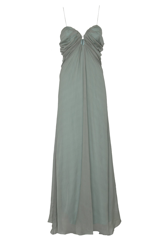 Raquel Diniz spaghetti strap maxi dress in dirty green, shown against a plaid white background.