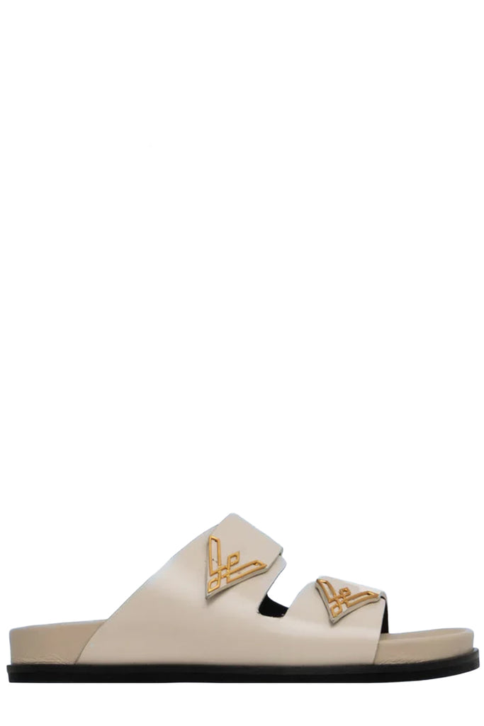 Vanda Novak sandal in white made from leather with golden details, shown against plaid white background.