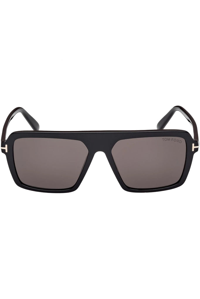 Tom Ford rectangular sunglasses in gray with black frame and metal T detail, shown against plaid white background.