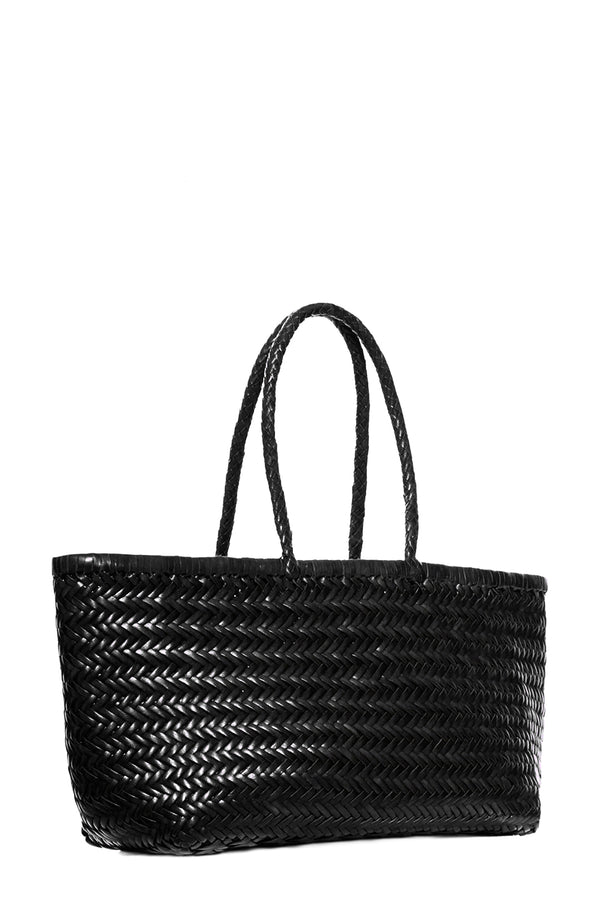Rotated view of Dragon Diffusion rectangular woven leather tote bag in black, shown against a plain white background.